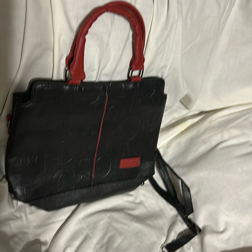 Black purse , red handles&trim,middle zip closure-divided,shoulder strap